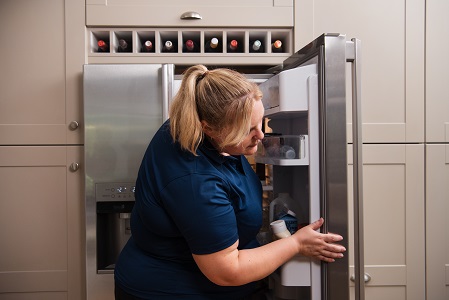 D&G engineer repairing a fridge